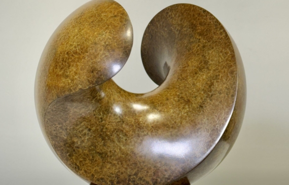 Alt text: Spherical bronze sculpture