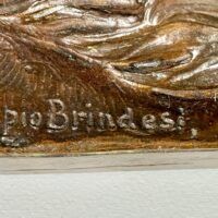 Alt text: Bronze sculpture, signature detail