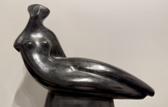Alt text: Abstracted sculpture of a reclining nude figure