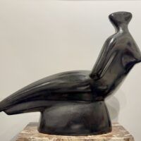 Alt text: Abstracted sculpture of a reclining nude figure