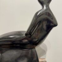 Alt text: Abstracted sculpture of a reclining nude figure