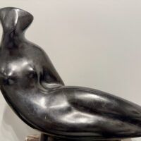 Alt text: Abstracted sculpture of a reclining nude figure