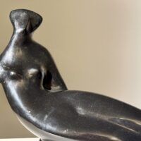 Alt text: Abstracted sculpture of a reclining nude figure