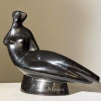 Alt text: Abstracted sculpture of a reclining nude figure