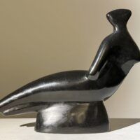 Alt text: Abstracted sculpture of a reclining nude figure