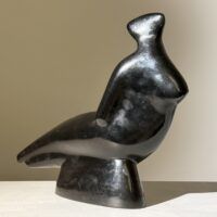 Alt text: Abstracted sculpture of a reclining nude figure