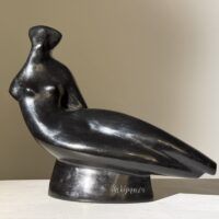 Alt text: Abstracted sculpture of a reclining nude figure