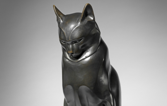 Alt text: Sculpture of a seated cat