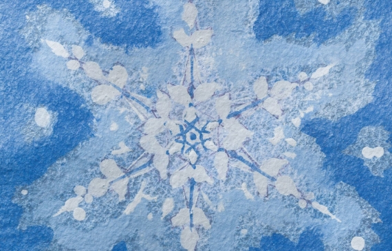 Alt text: watercolor painting of a snowflake in blue