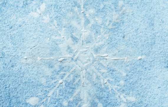 Alt text: watercolor painting of a snowflake in blue