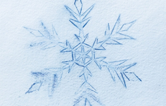 Alt text: watercolor painting of a snowflake in blue