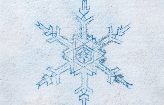 Alt text: watercolor painting of a snowflake in blue