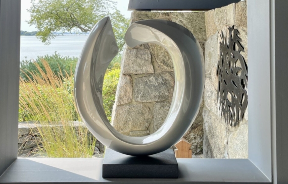 Alt text: oval-shaped sculpture in a window