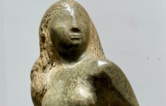 Alt text: Green marble sculpture of a nude woman