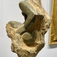 Alt text: Green marble sculpture of a nude woman