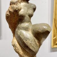 Alt text: Green marble sculpture of a nude woman