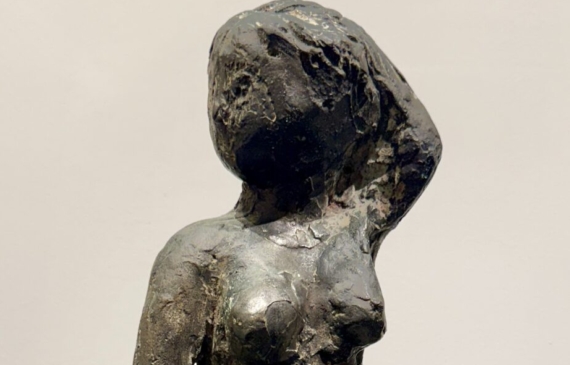 Alt text: Bronze sculpture of an Etruscan style nude female figure