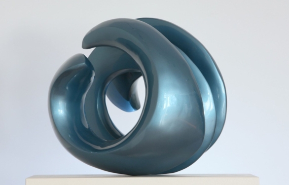 Alt text: Abstract blue sculpture, outdoors