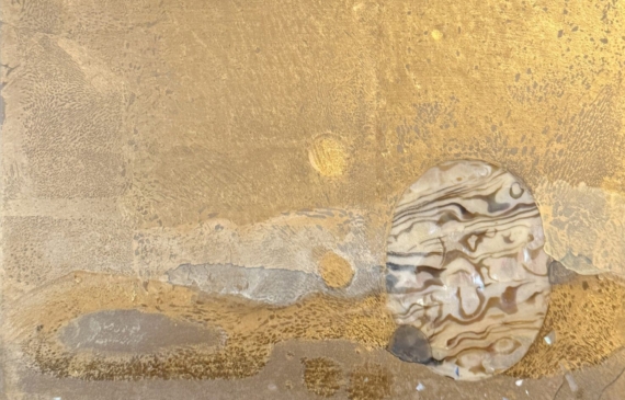 Alt text: Mixed media artwork with gold