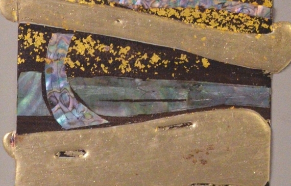 Alt text: Mixed media artwork with gold