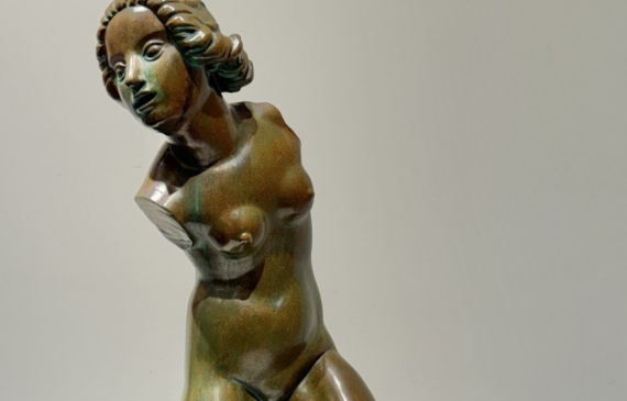 Alt text: Bronze sculpture of a fragmented nude woman