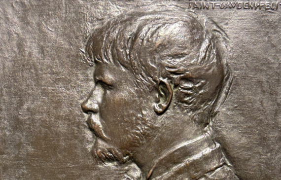 Alt text: Bronze bas relief of a man in profile with a paintbrush and palette