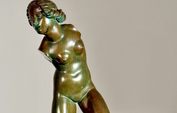 Alt text: Bronze sculpture of a fragmented nude woman
