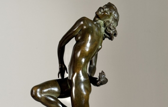 Alt text: Bronze sculpture of a nude woman skipping and holding a fish in one hand