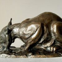 Alt text: Bronzes sculpture of a lynx eating a hare