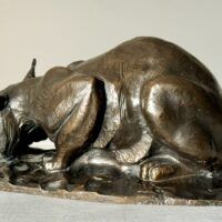 Alt text: Bronzes sculpture of a lynx eating a hare