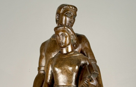 Alt text: Bronze sculpture of a standing family