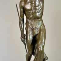 Alt text: Bronze sculpture of a Native American man looking into the distance