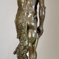 Alt text: Bronze sculpture of a Native American man looking into the distance