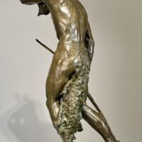 Alt text: Bronze sculpture of a Native American man looking into the distance
