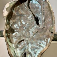 Alt text: Bronze sculpture, underside detail