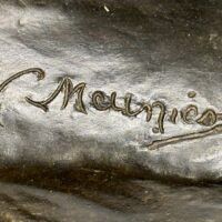 Alt text: Bronze sculpture, signature detail